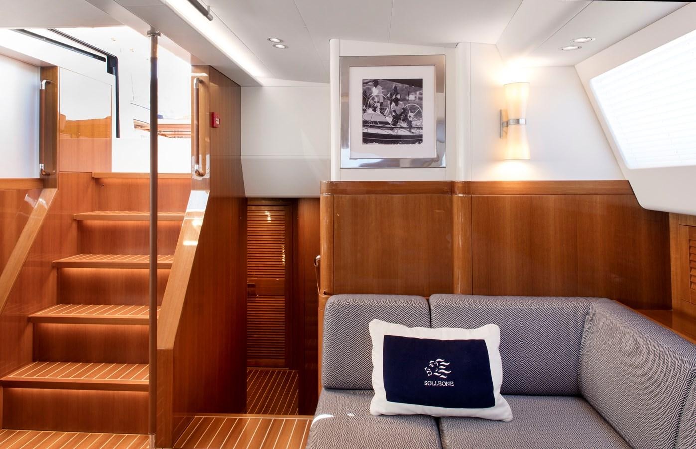 a couch in a room aboard SOLLEONE Yacht for Sale