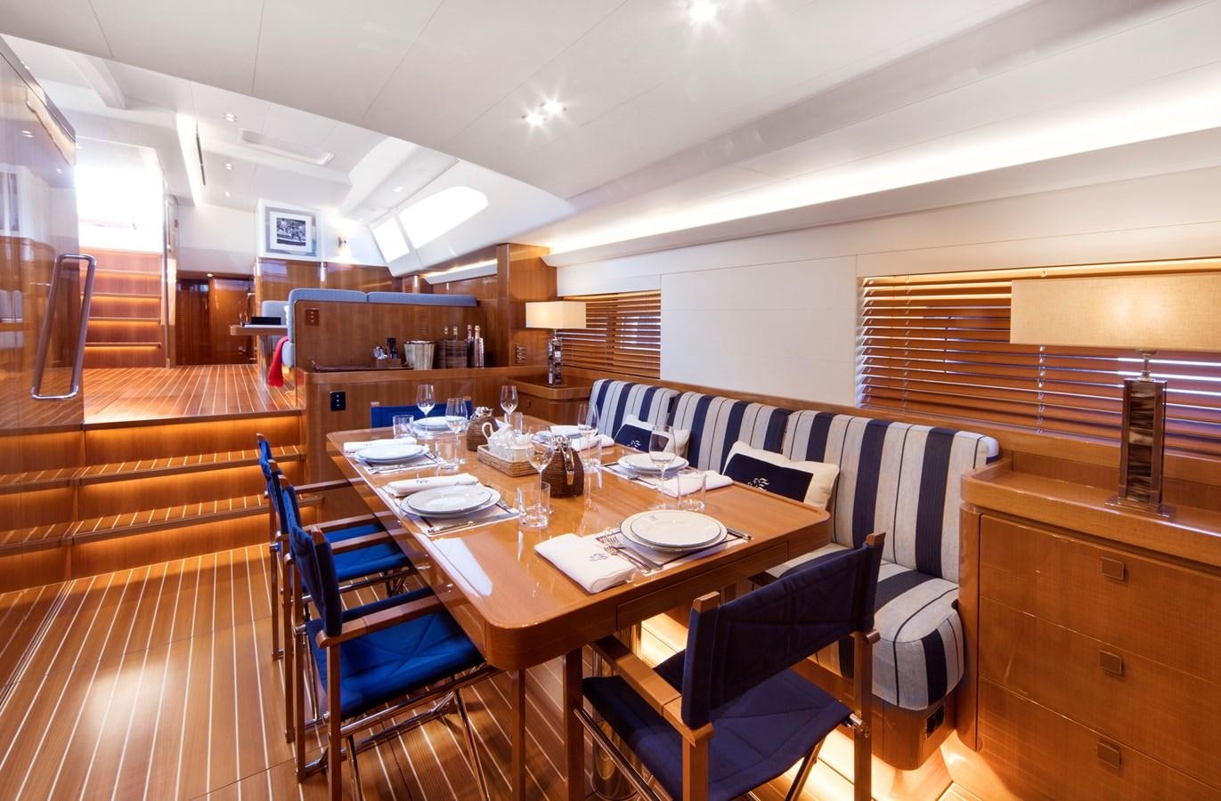 a dining table in a room aboard SOLLEONE Yacht for Sale