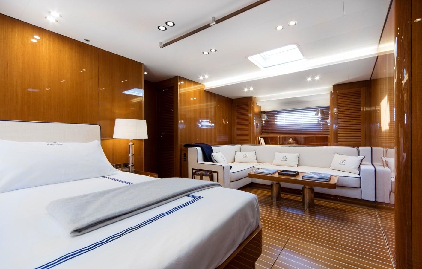 a room with a bed and a couch aboard SOLLEONE Yacht for Sale