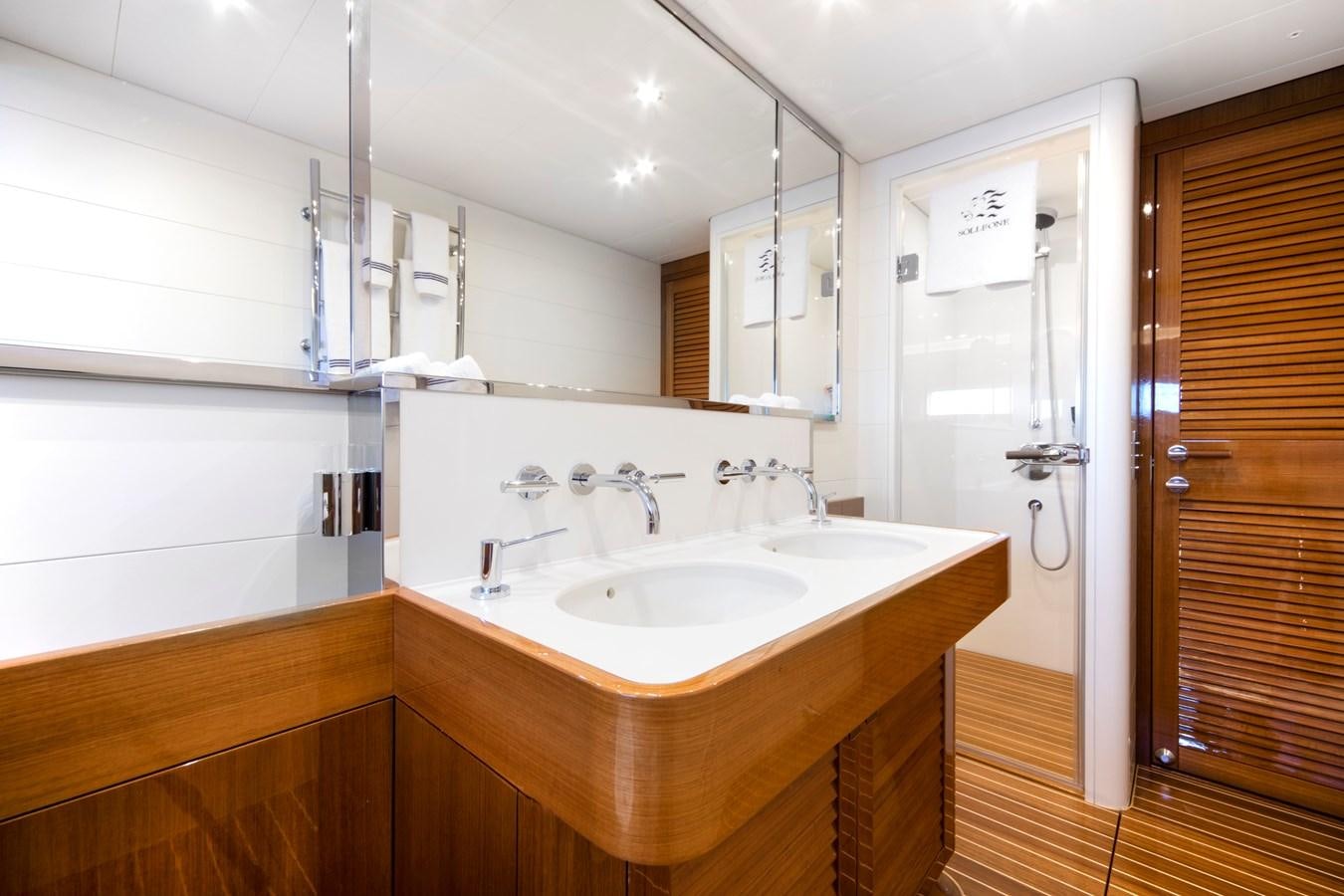 a bathroom with a sink and a mirror aboard SOLLEONE Yacht for Sale