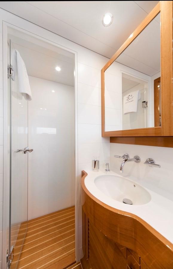 a bathroom with a sink and a mirror aboard SOLLEONE Yacht for Sale