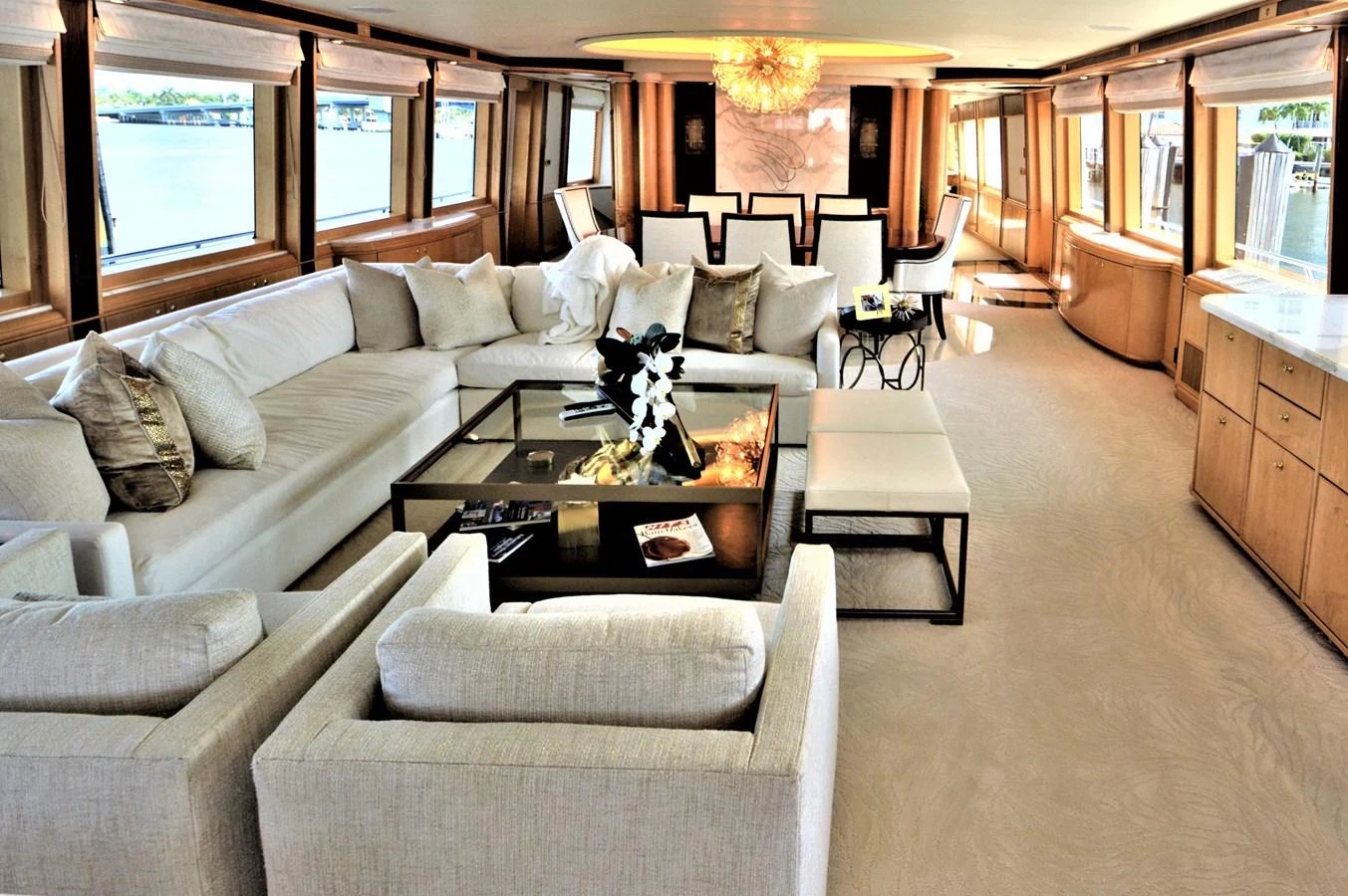 a living room with a couch and a coffee table aboard MISS STEPHANIE Yacht for Sale