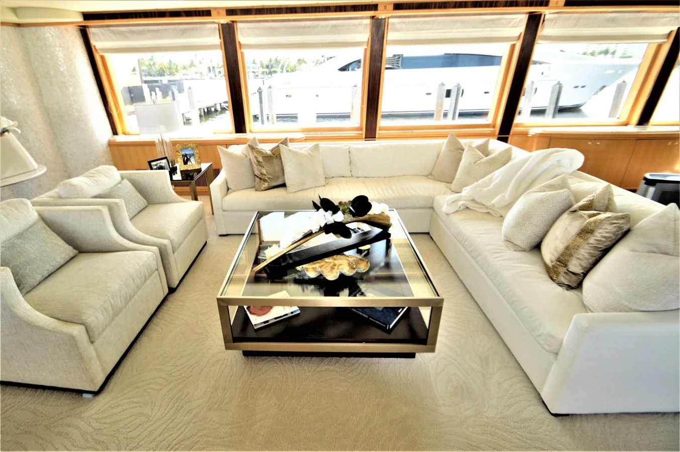 a living room with a couch and a coffee table aboard MISS STEPHANIE Yacht for Sale