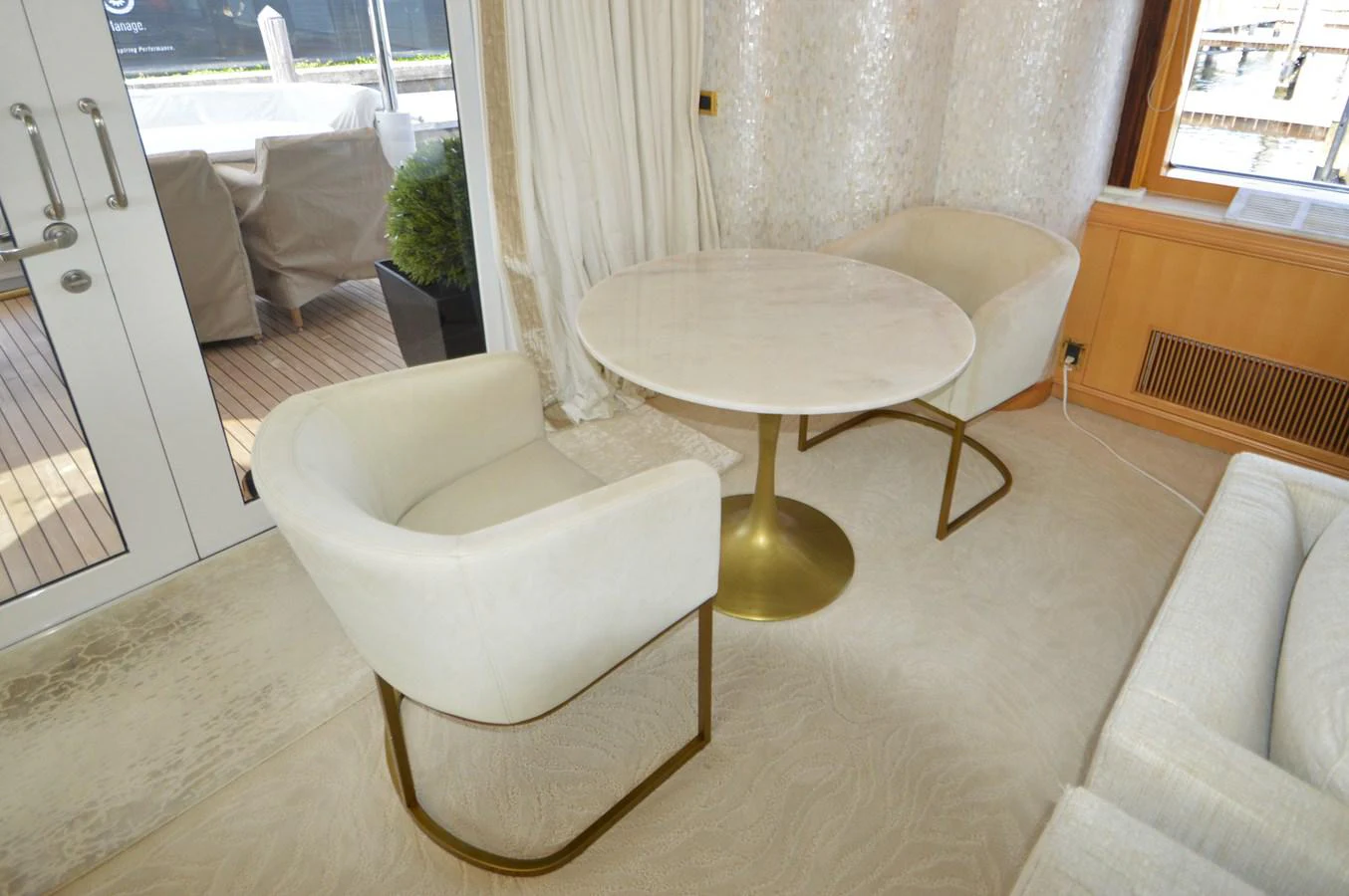 a table and chairs in a room aboard MISS STEPHANIE Yacht for Sale