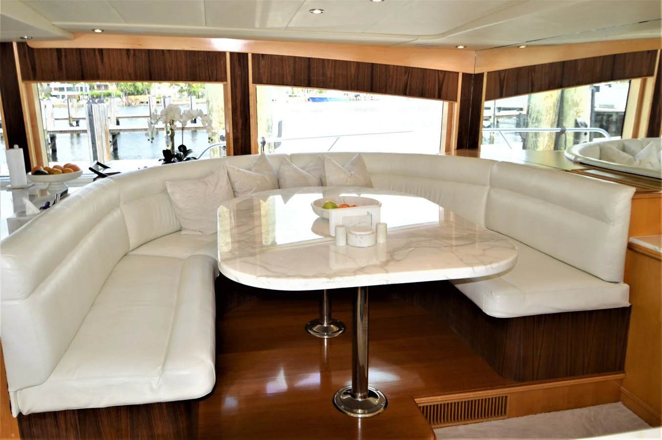 a table with chairs around it aboard MISS STEPHANIE Yacht for Sale