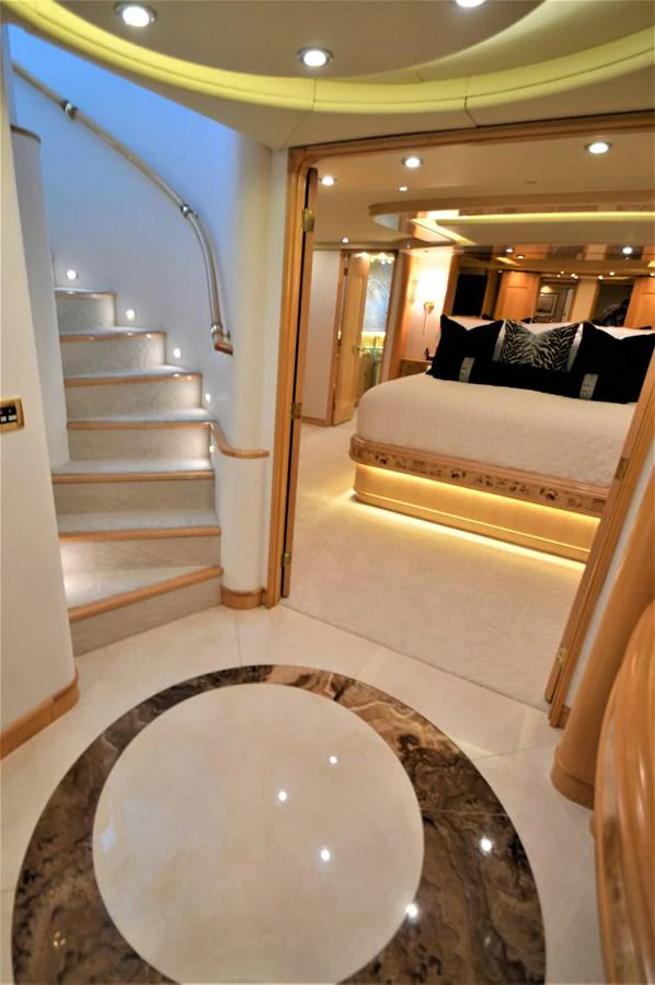 a hallway with a bed and a staircase aboard MISS STEPHANIE Yacht for Sale