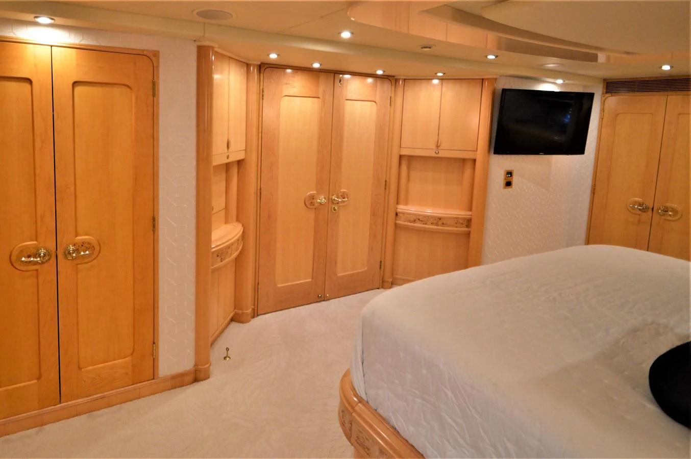 a room with a bed and a television aboard MISS STEPHANIE Yacht for Sale