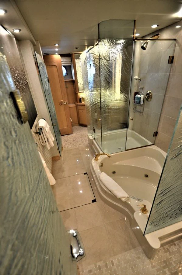 a bathroom with a glass shower aboard MISS STEPHANIE Yacht for Sale