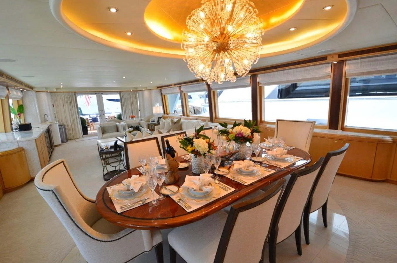 a dining room with a chandelier aboard MISS STEPHANIE Yacht for Sale