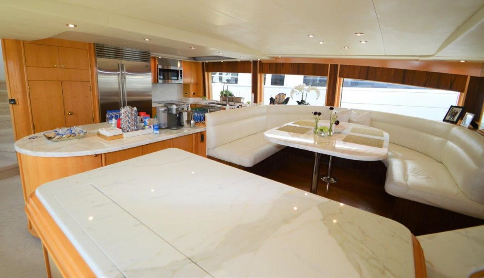 a kitchen with a table and chairs aboard MISS STEPHANIE Yacht for Sale