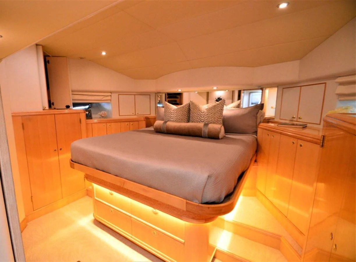 a bedroom with a bed aboard MISS STEPHANIE Yacht for Sale