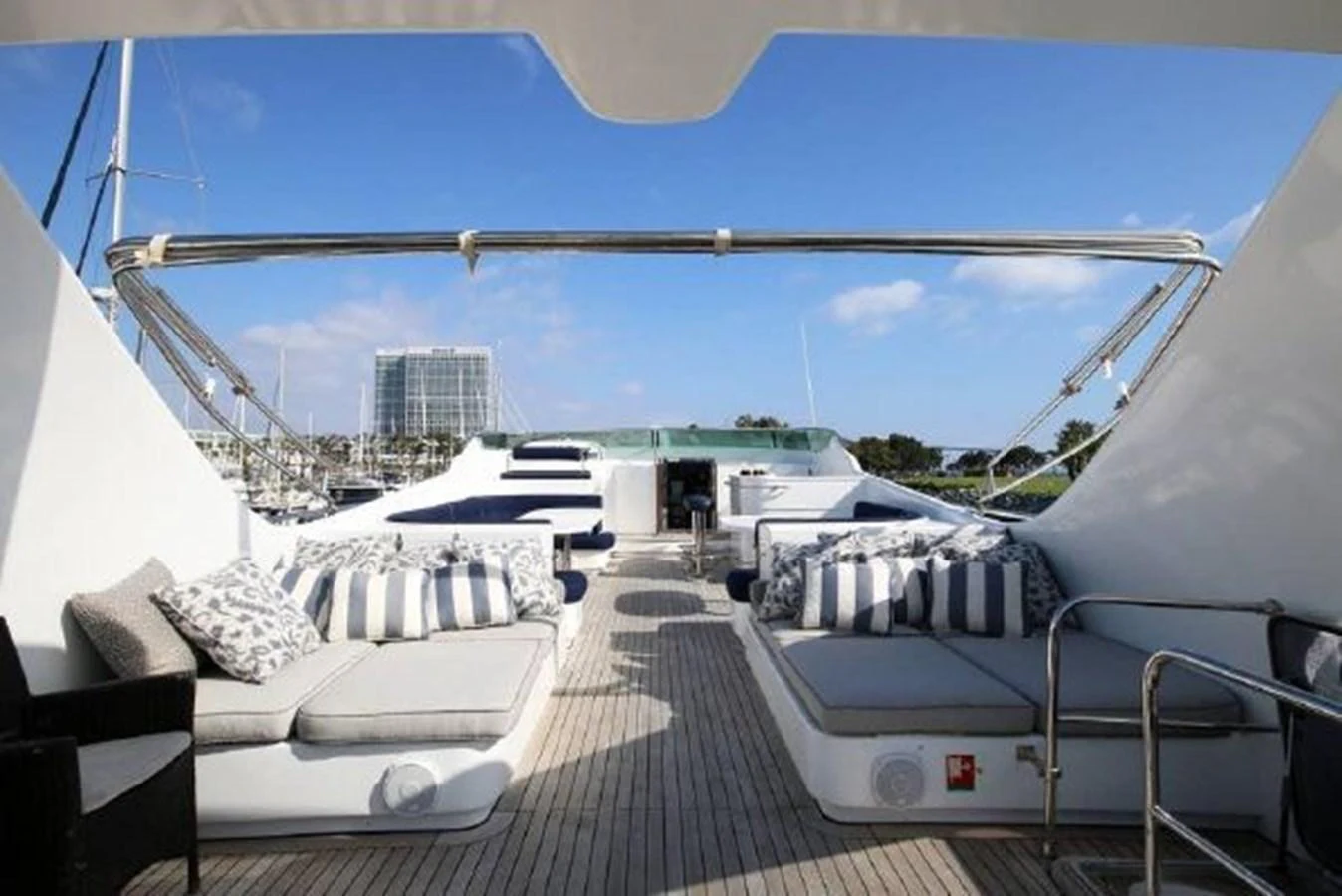 a deck with a view of a city and water aboard AMADEUS Yacht for Sale