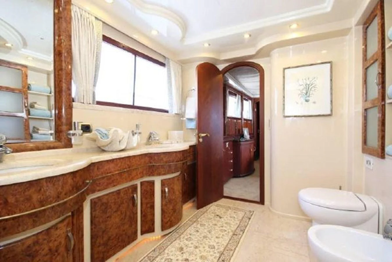 a bathroom with a marble counter top aboard AMADEUS Yacht for Sale
