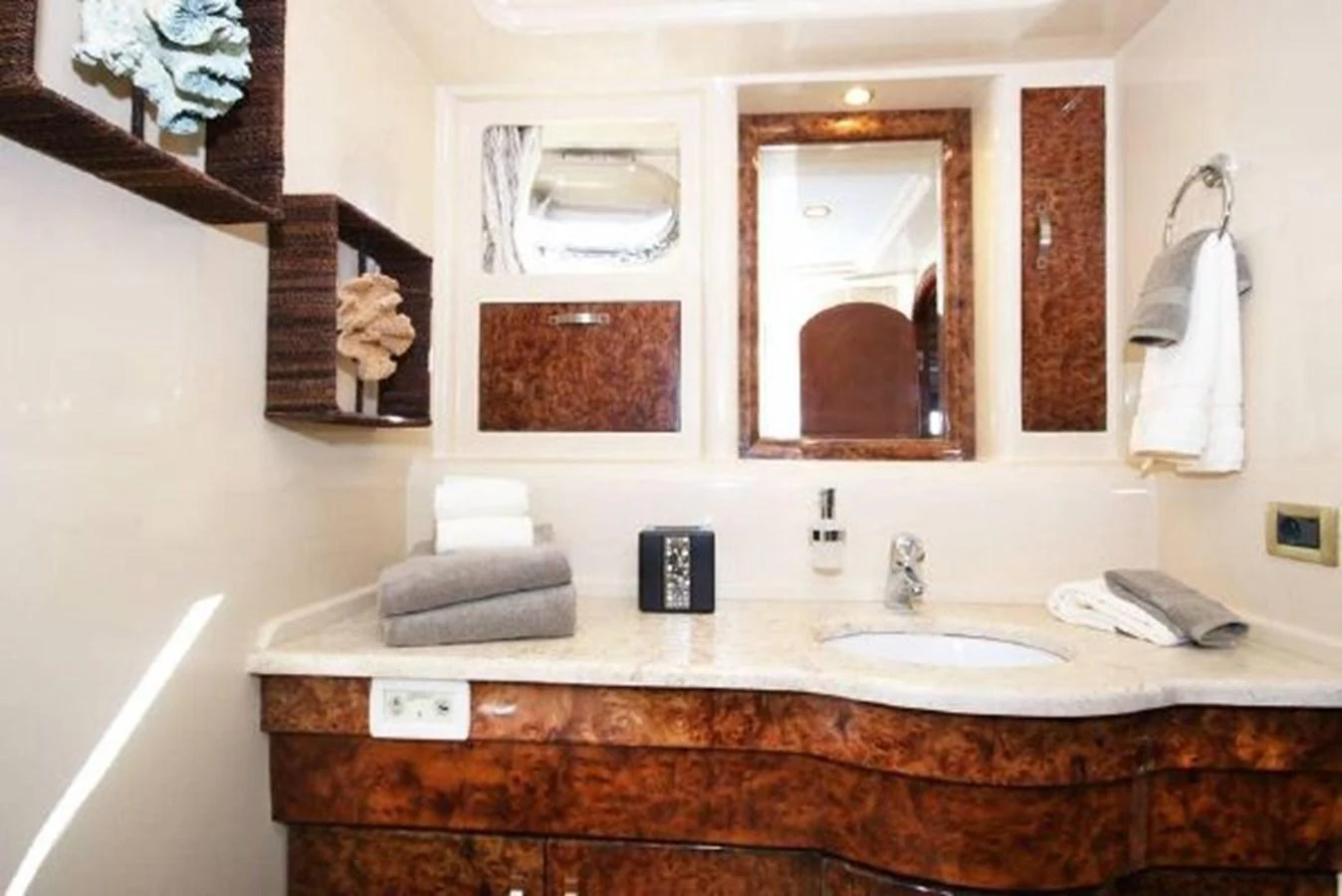 a bathroom with a mirror and a sink aboard AMADEUS Yacht for Sale