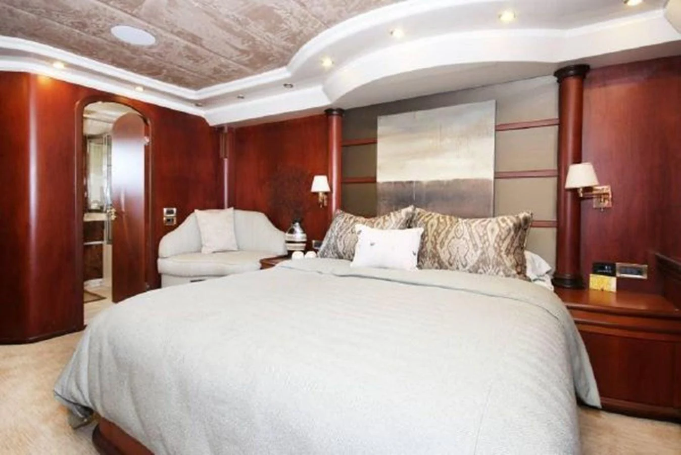 a large bed in a hotel room aboard AMADEUS Yacht for Sale