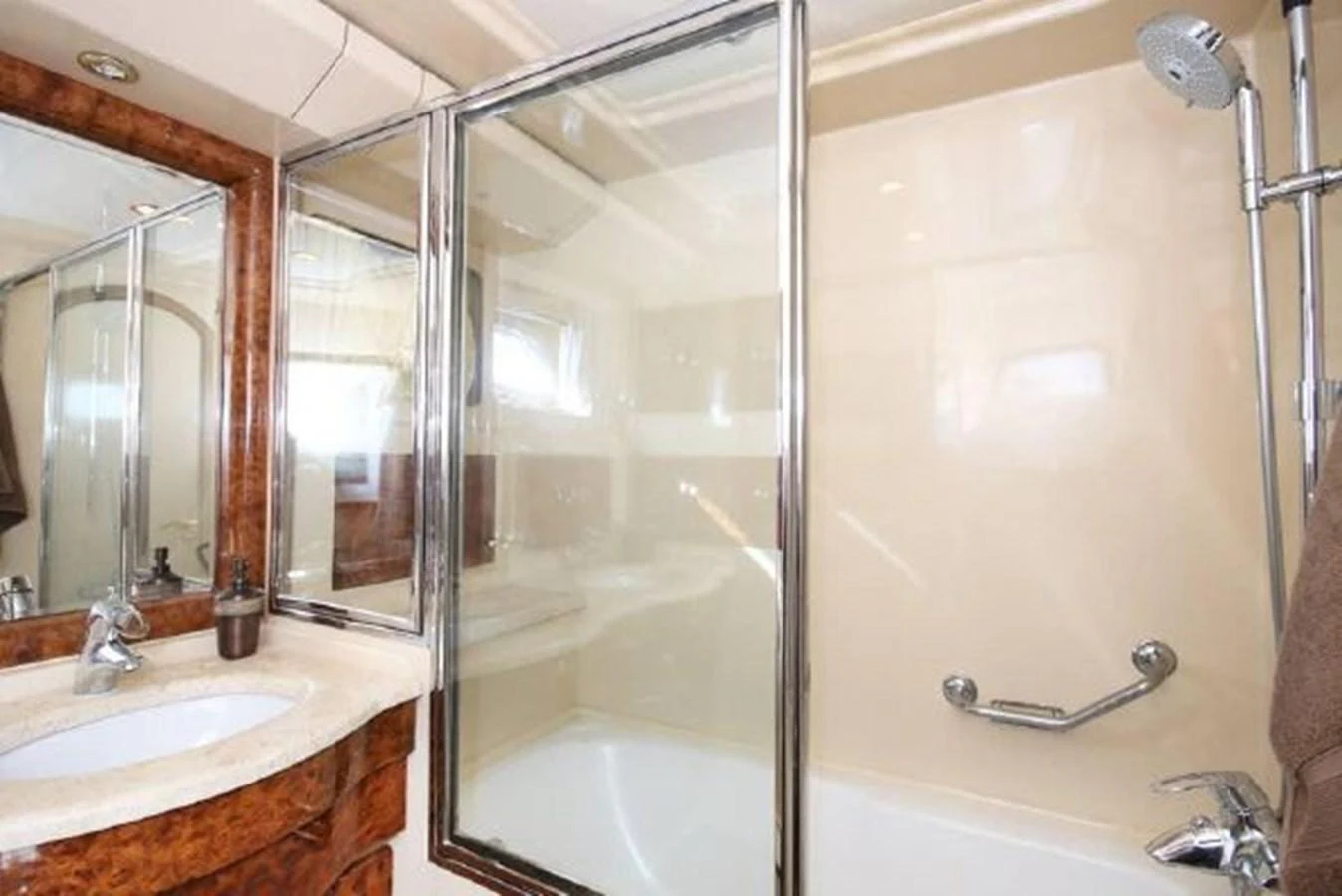 a bathroom with a glass shower aboard AMADEUS Yacht for Sale