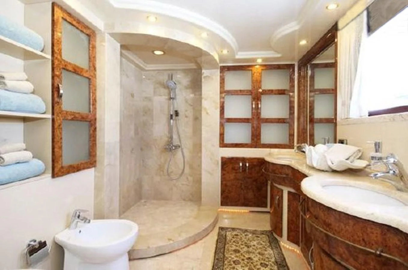 a bathroom with a shower and sink aboard AMADEUS Yacht for Sale