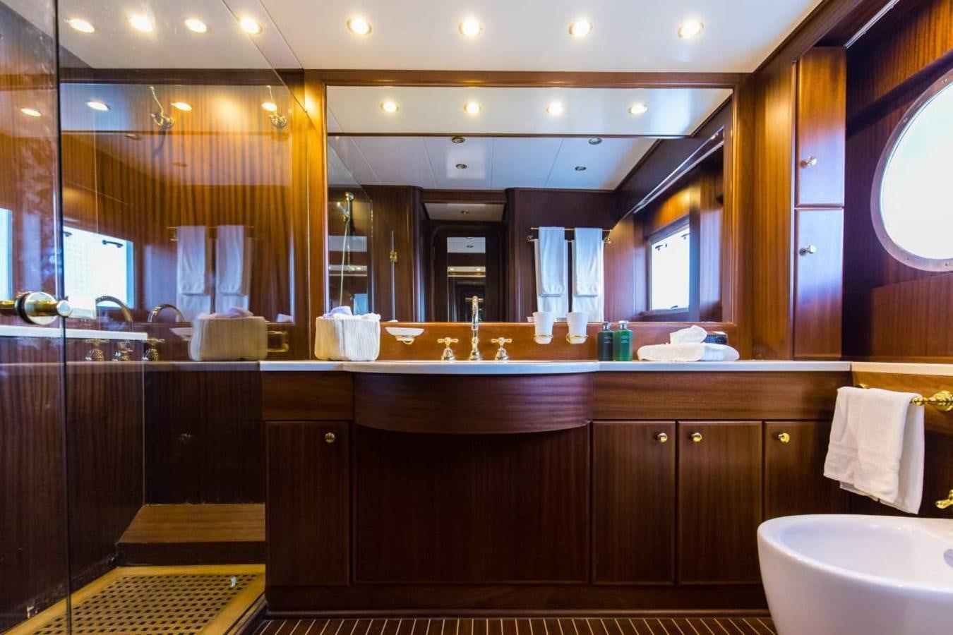 a bathroom with a large mirror aboard INDIA Yacht for Sale