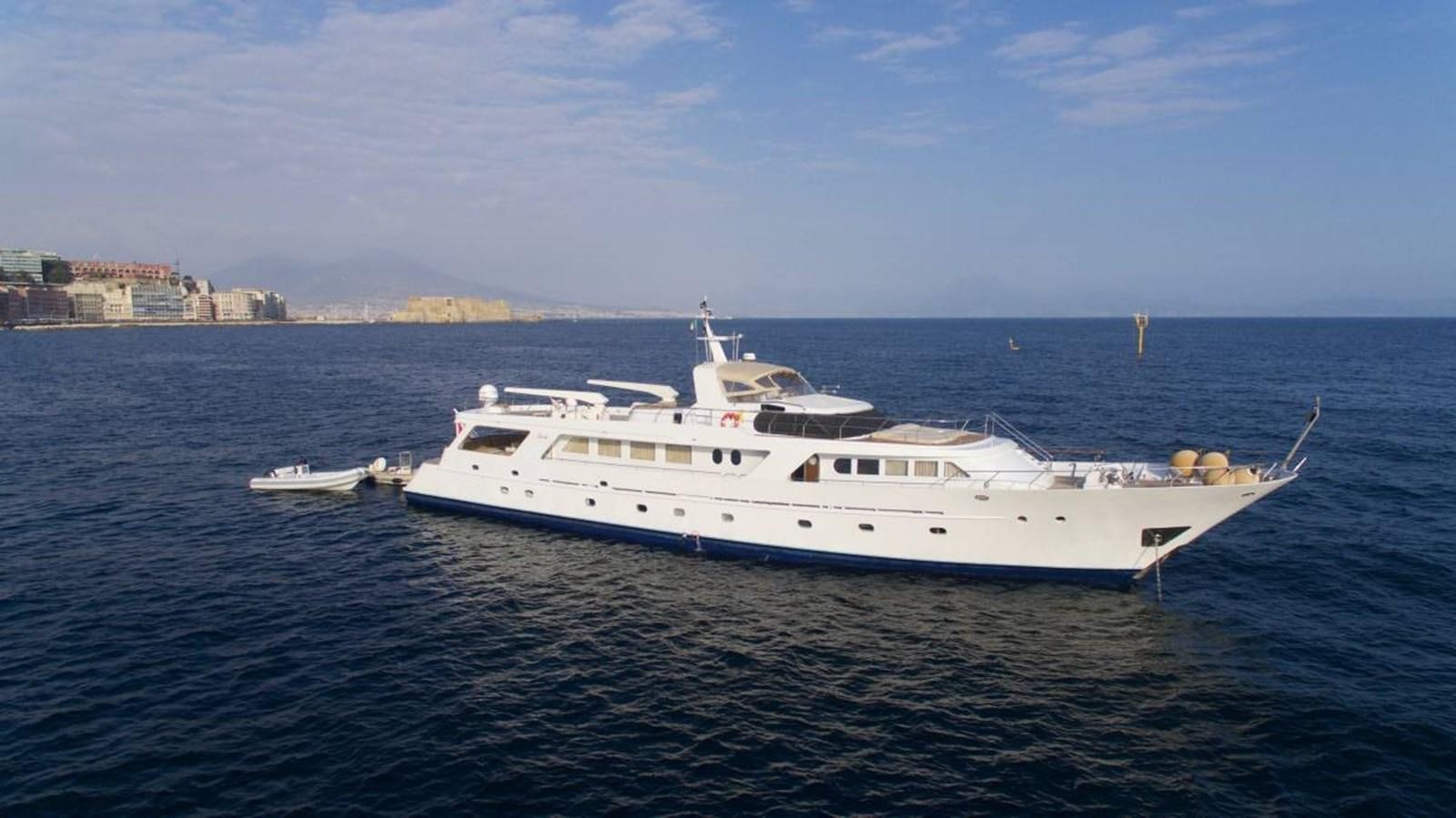 a large white yacht in the water aboard INDIA Yacht for Sale