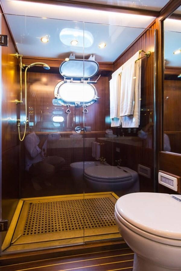 a bathroom with a large mirror aboard INDIA Yacht for Sale