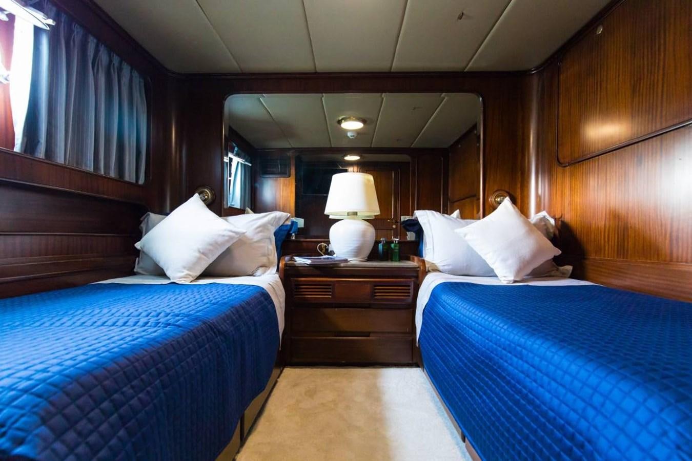 a room with two beds aboard INDIA Yacht for Sale
