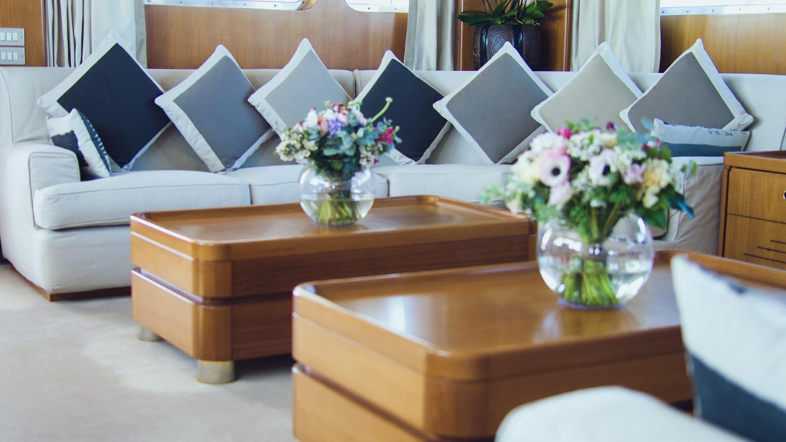 a vase of flowers on a table aboard FREEMONT Yacht for Charter