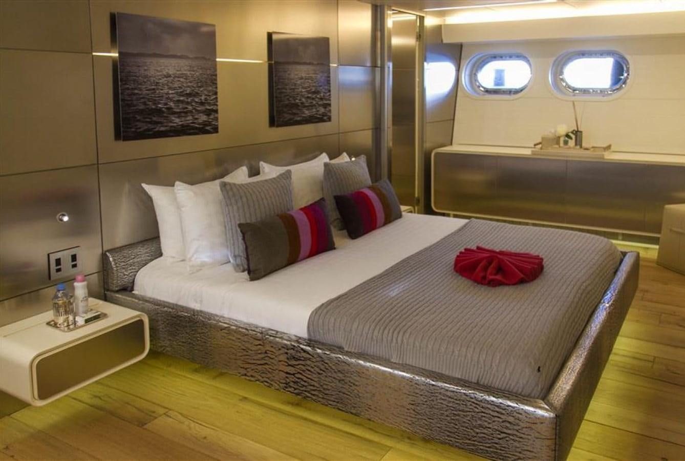 a bed with a white bed spread aboard ADMIRAL 35 Yacht for Sale