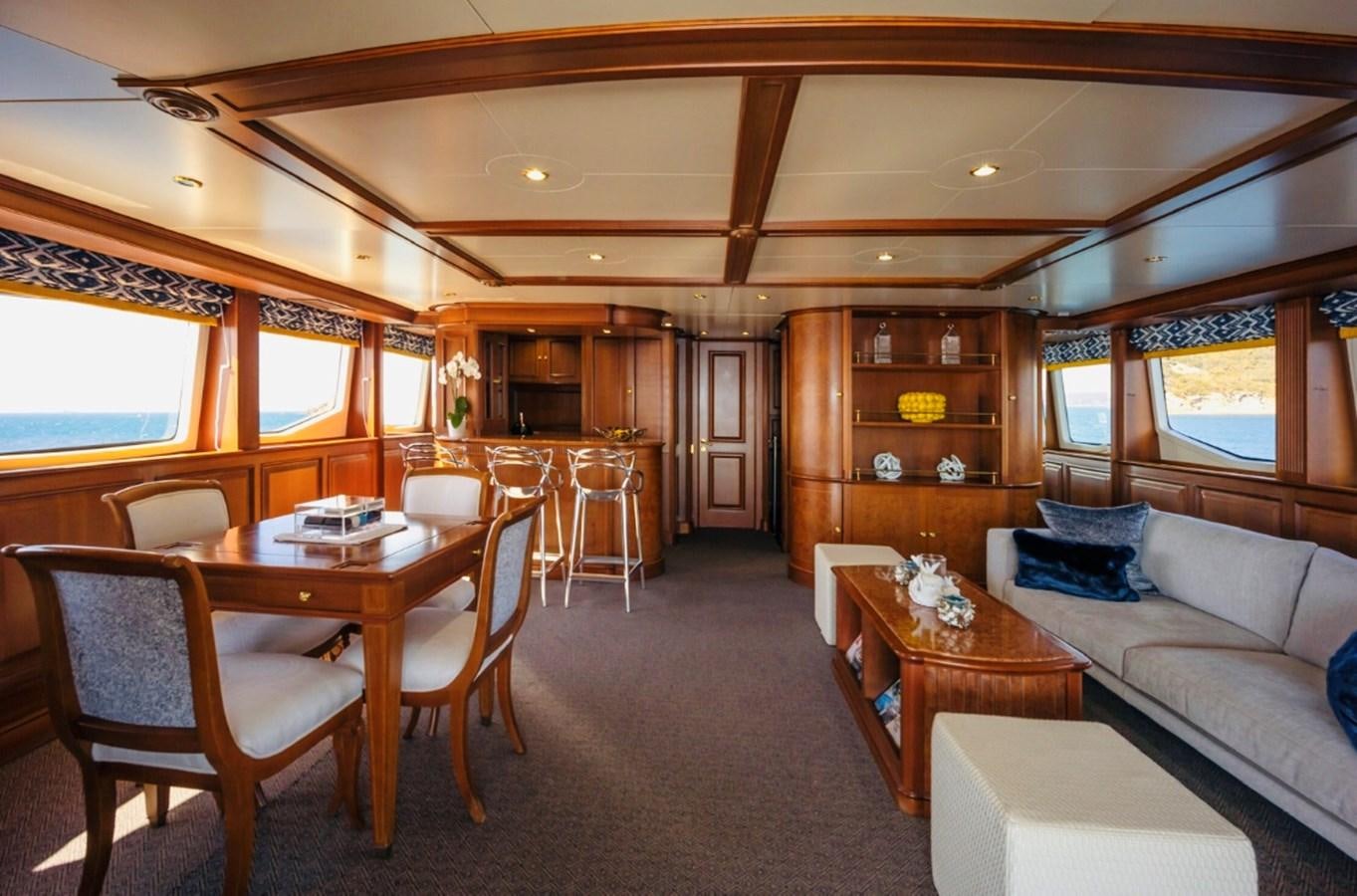 a living room with a couch and a table aboard SERENO Yacht for Sale