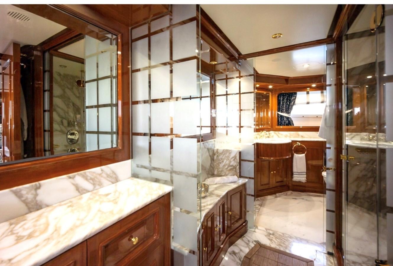 a bathroom with a large mirror aboard SERENO Yacht for Sale