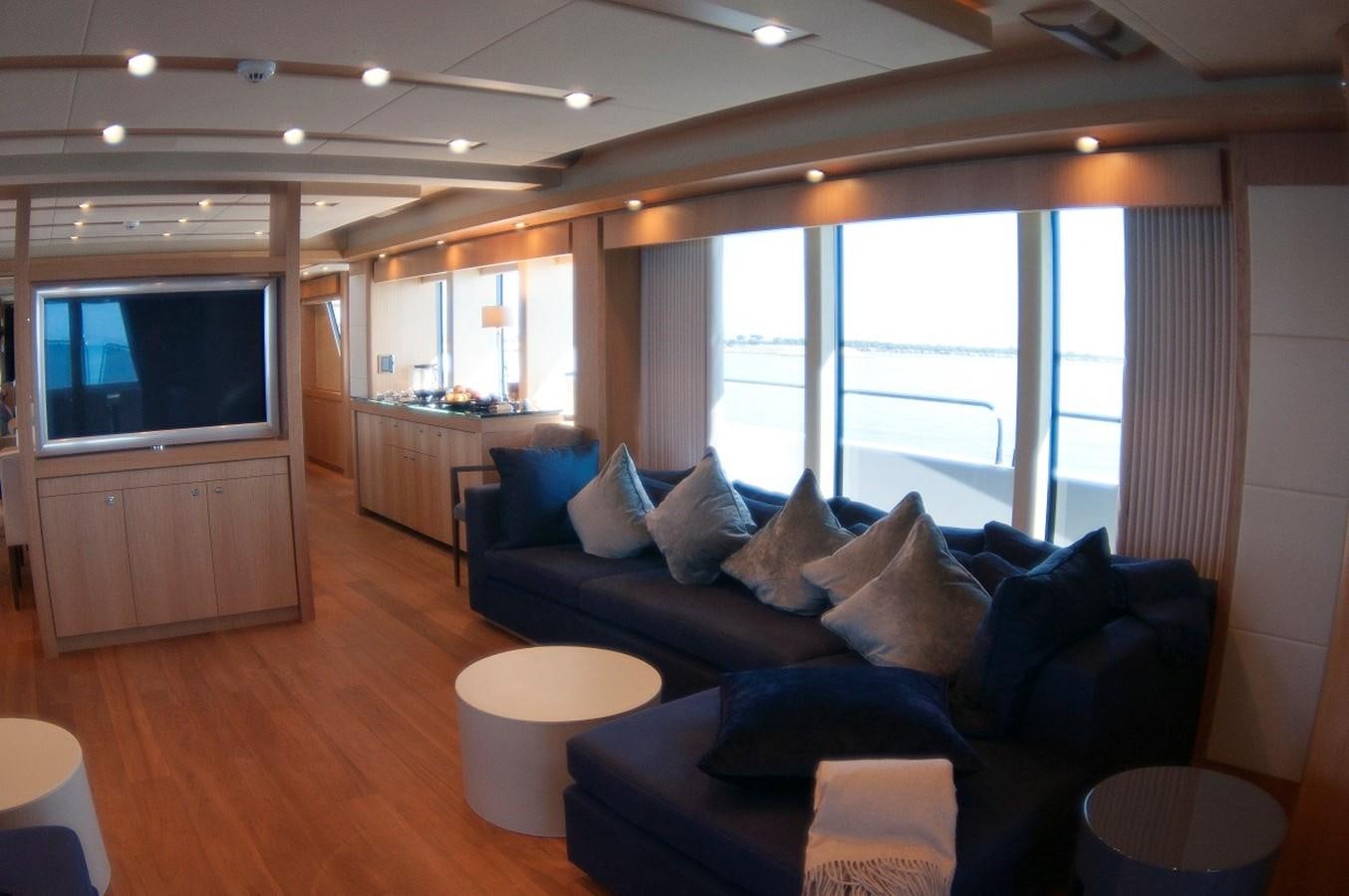 a living room with a large window aboard SUN FLOWER Yacht for Sale