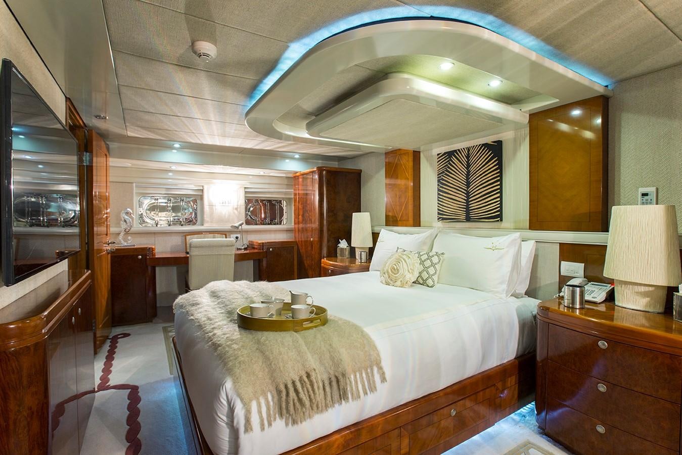 a large bedroom with a large bed aboard PRINCESS ILUKA Yacht for Sale
