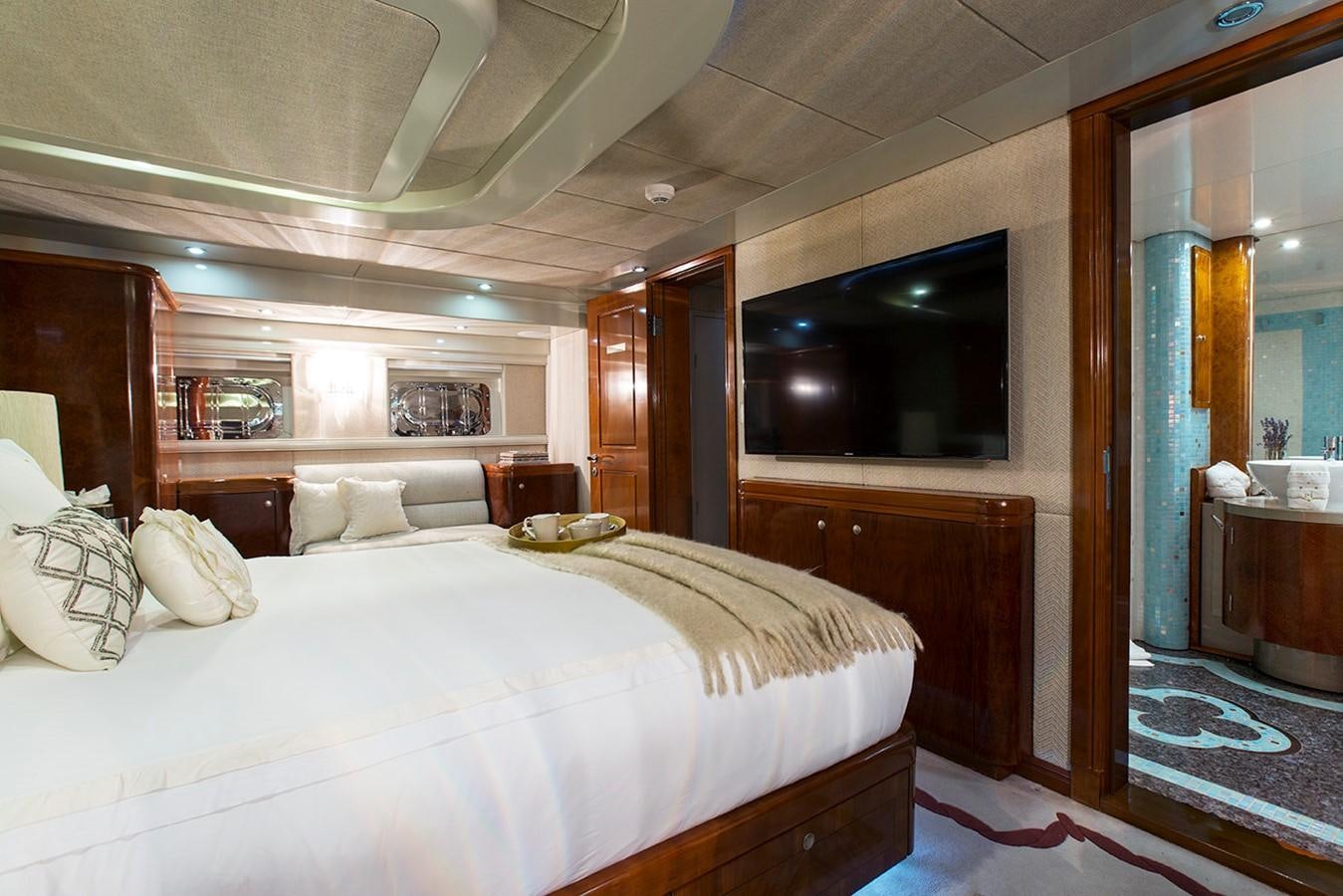 a large bedroom with a large bed aboard PRINCESS ILUKA Yacht for Sale