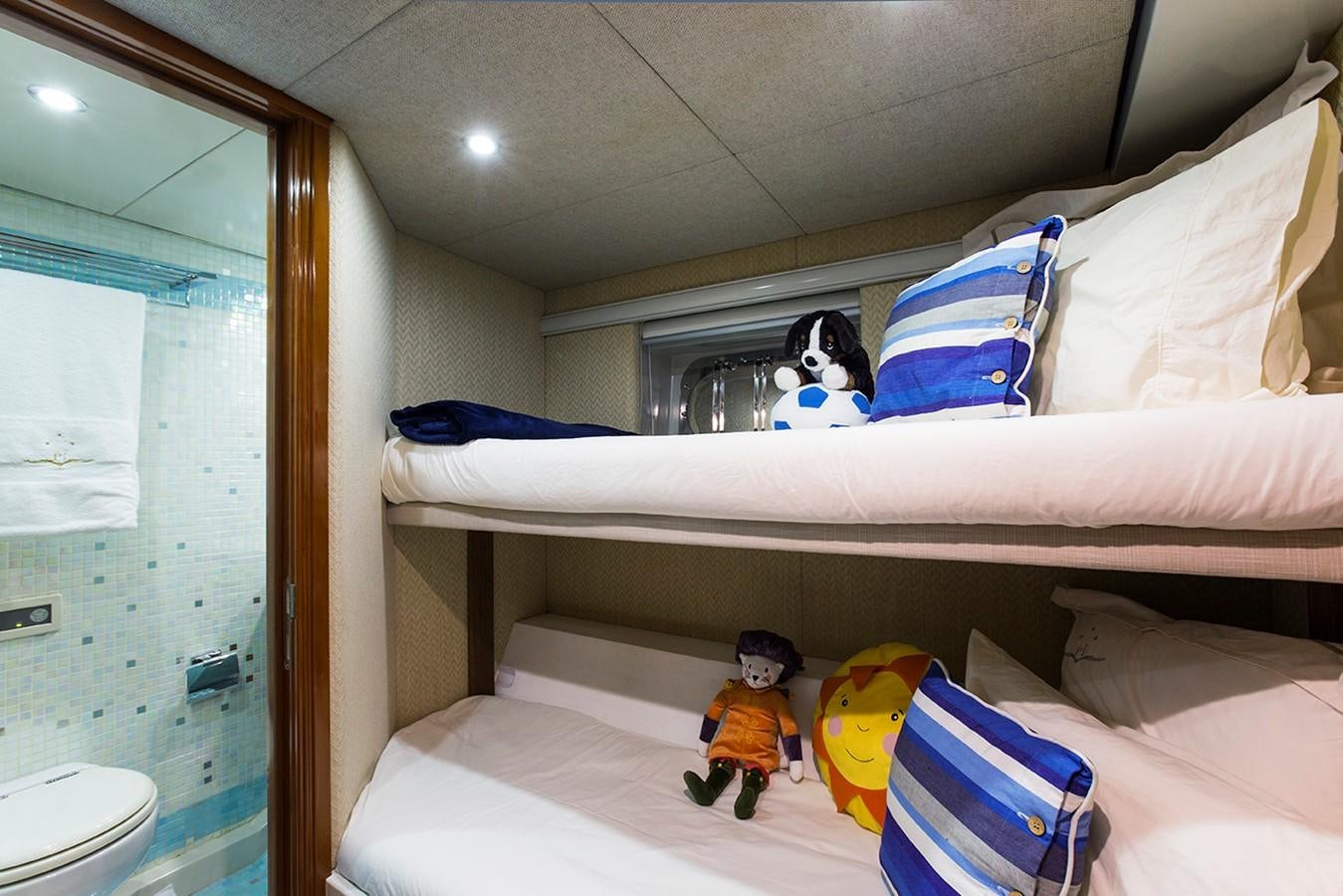 a room with a bed and a window aboard PRINCESS ILUKA Yacht for Charter