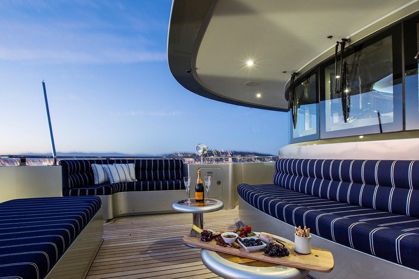 a living room with a couch and a table aboard PRINCESS ILUKA Yacht for Sale