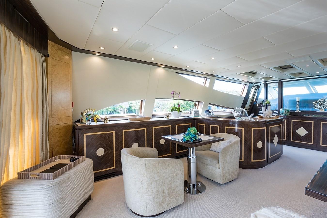 a room with a table chairs and a couch aboard 34M LEOPARD Yacht for Sale