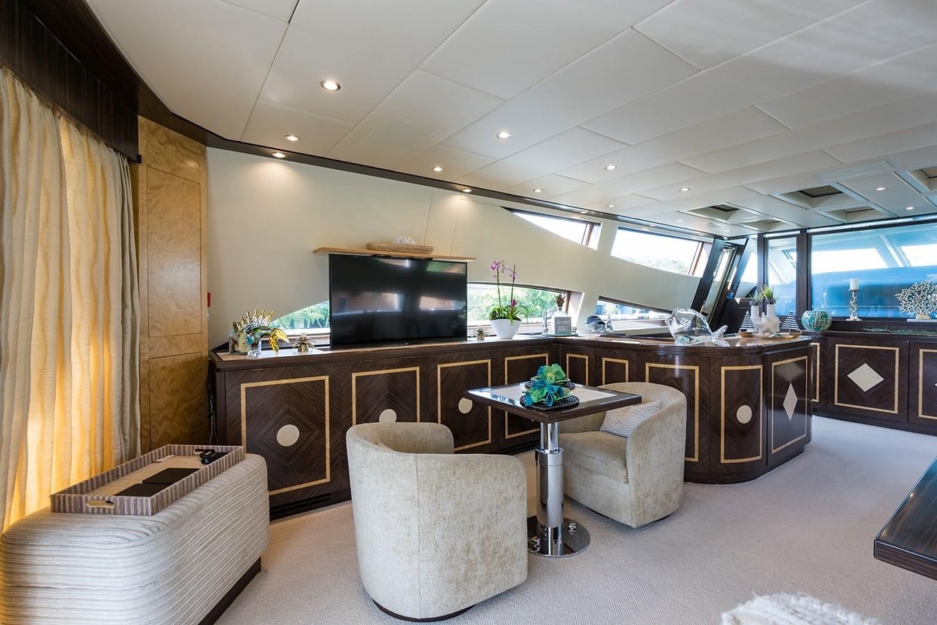 a room with a table and chairs aboard 34M LEOPARD Yacht for Sale