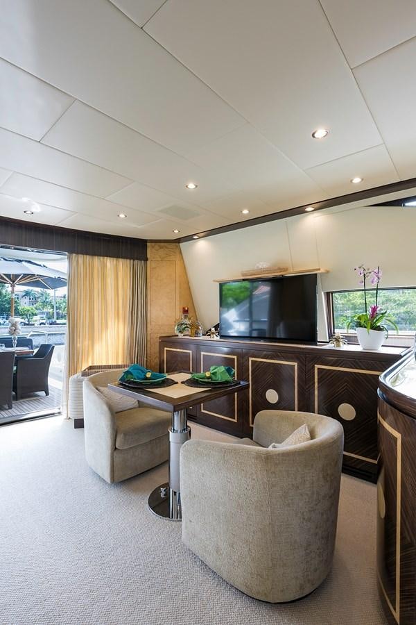 a living room with a couch and a tv aboard 34M LEOPARD Yacht for Sale