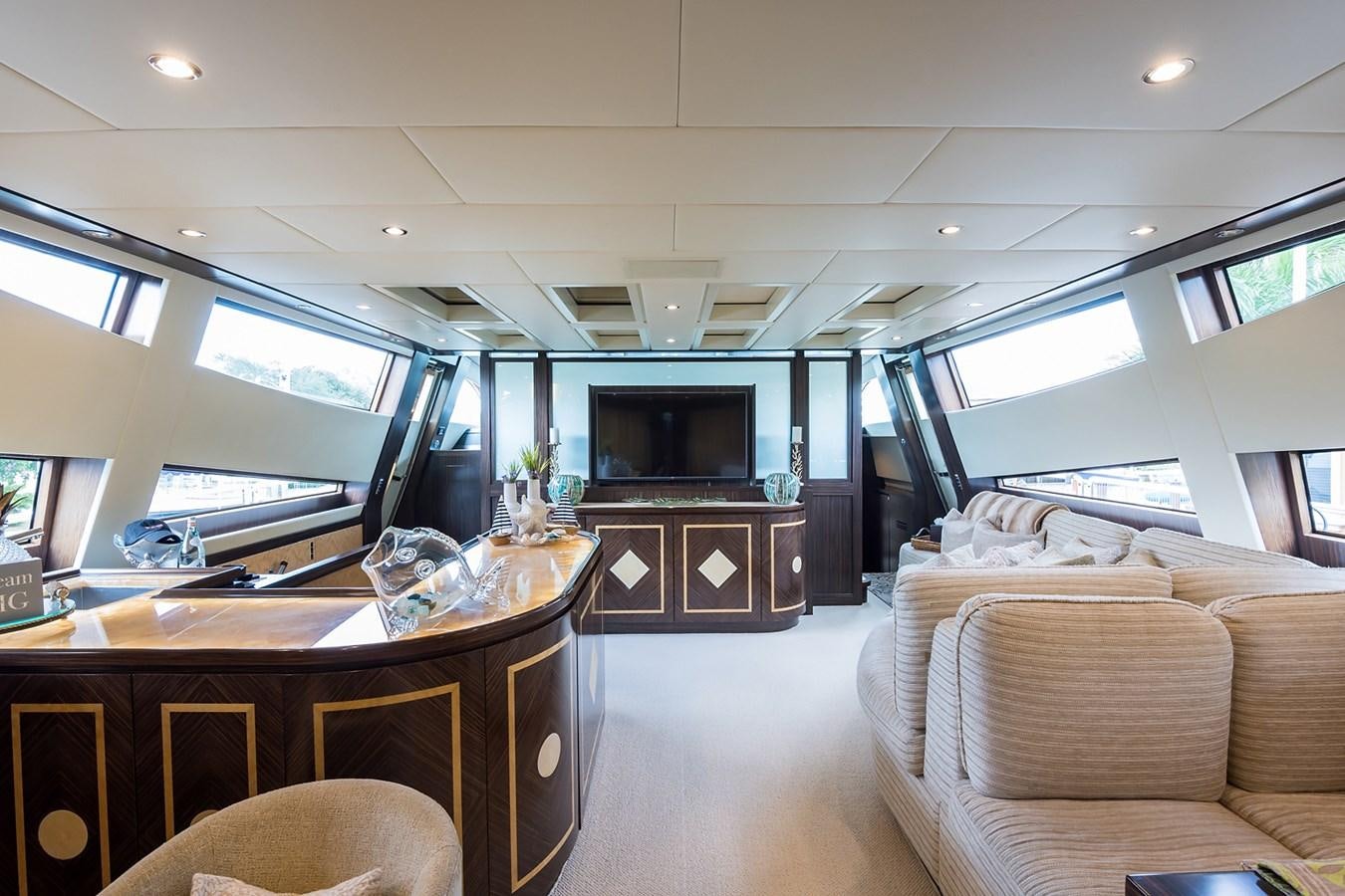 a room with a couch and a television aboard 34M LEOPARD Yacht for Sale