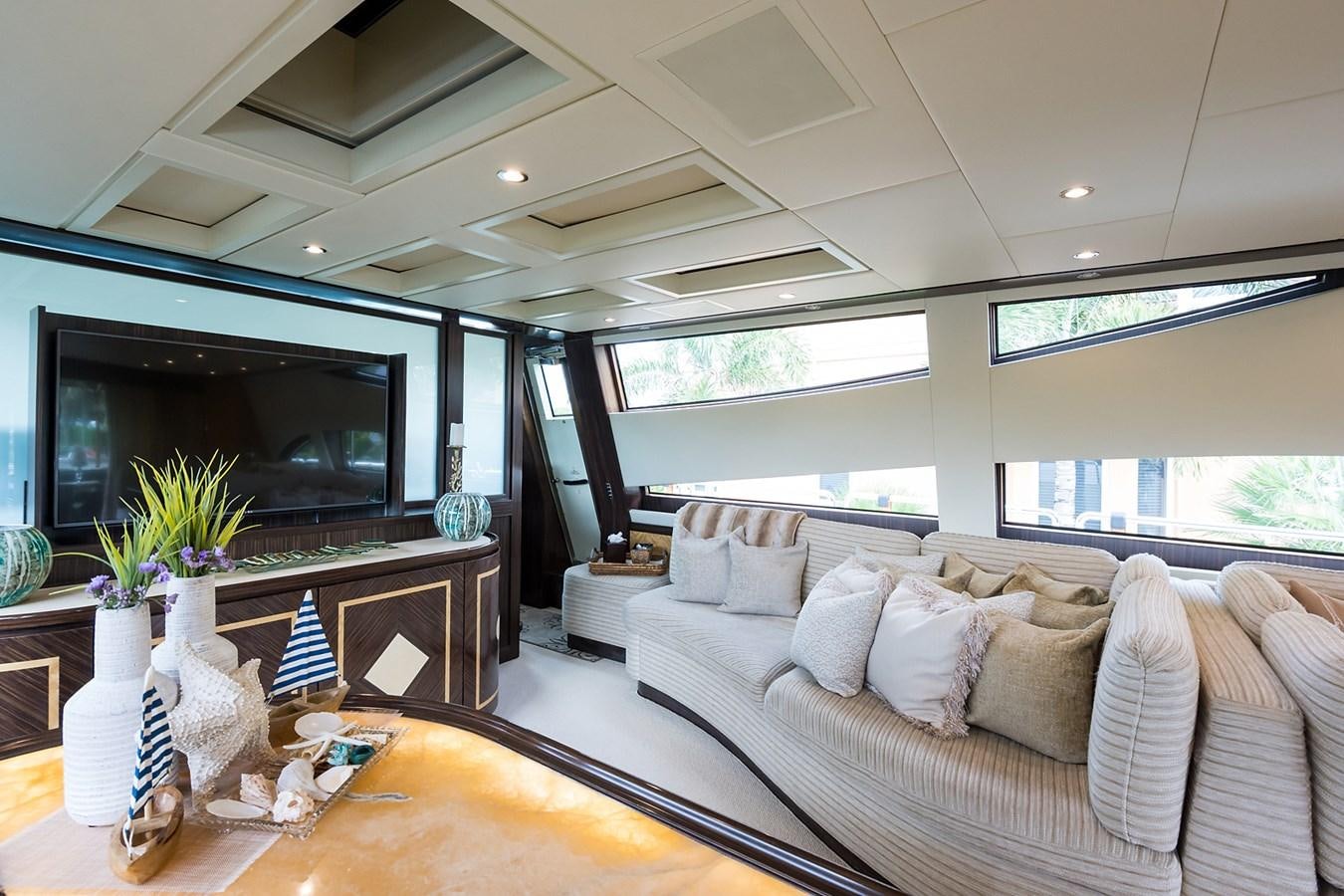 a living room with a large window aboard 34M LEOPARD Yacht for Sale