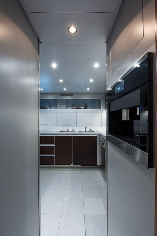 a kitchen with a large island aboard 34M LEOPARD Yacht for Sale