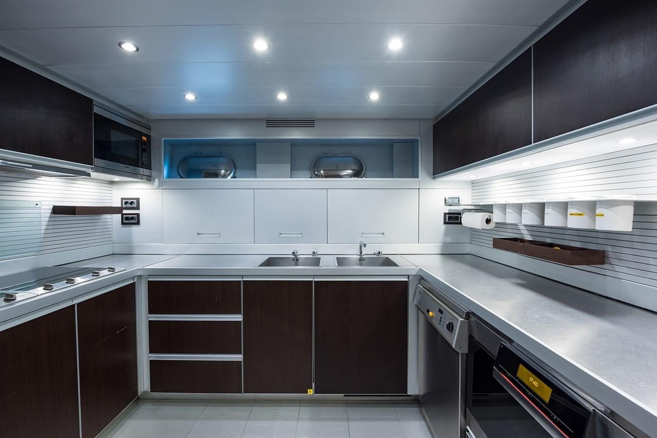a kitchen with a large island aboard 34M LEOPARD Yacht for Sale