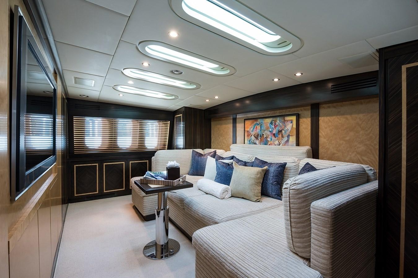 a room with a bed and a table aboard 34M LEOPARD Yacht for Sale