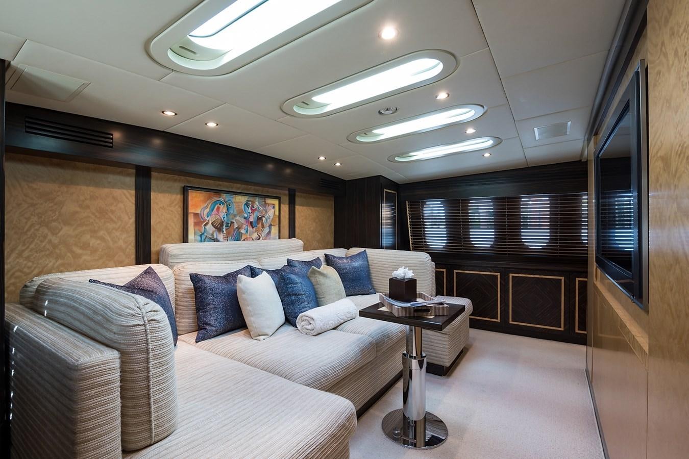 a living room with a couch and a table aboard 34M LEOPARD Yacht for Sale