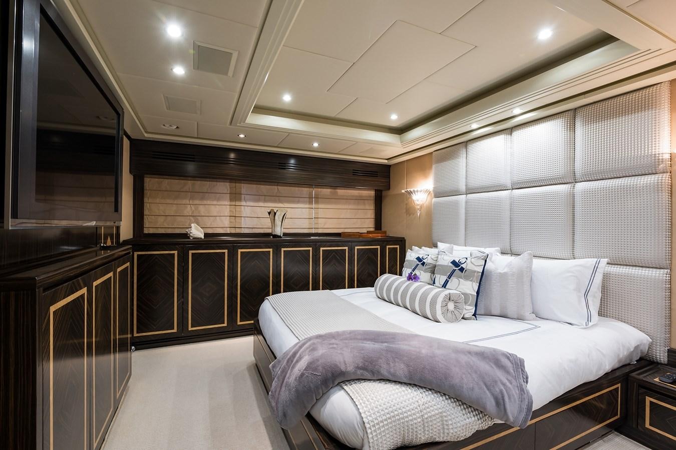 a large bedroom with a large bed aboard 34M LEOPARD Yacht for Sale