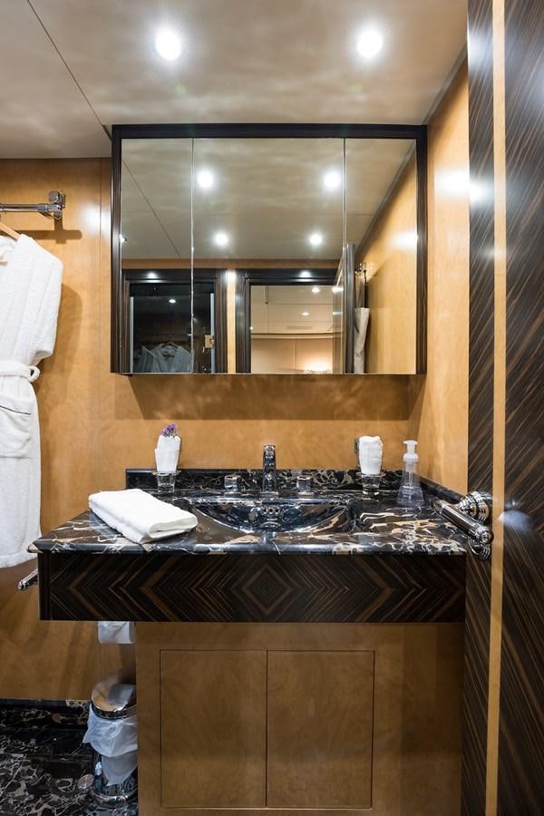 a bathroom with a large mirror aboard 34M LEOPARD Yacht for Sale