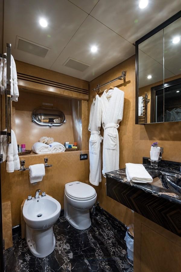 a bathroom with a sink and toilet aboard 34M LEOPARD Yacht for Sale