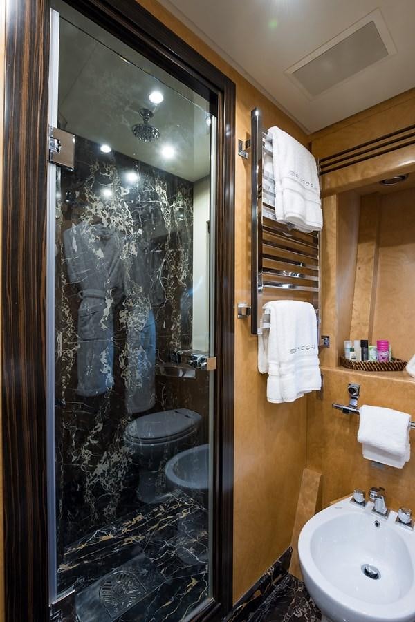 a bathroom with a glass shower aboard 34M LEOPARD Yacht for Sale