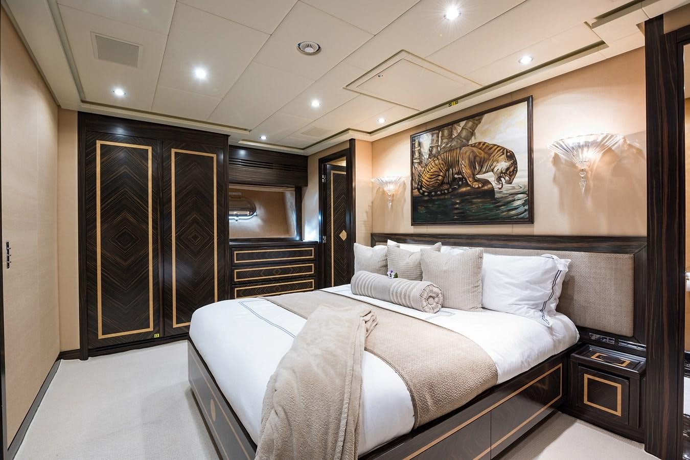 a large bedroom with a large bed aboard 34M LEOPARD Yacht for Sale