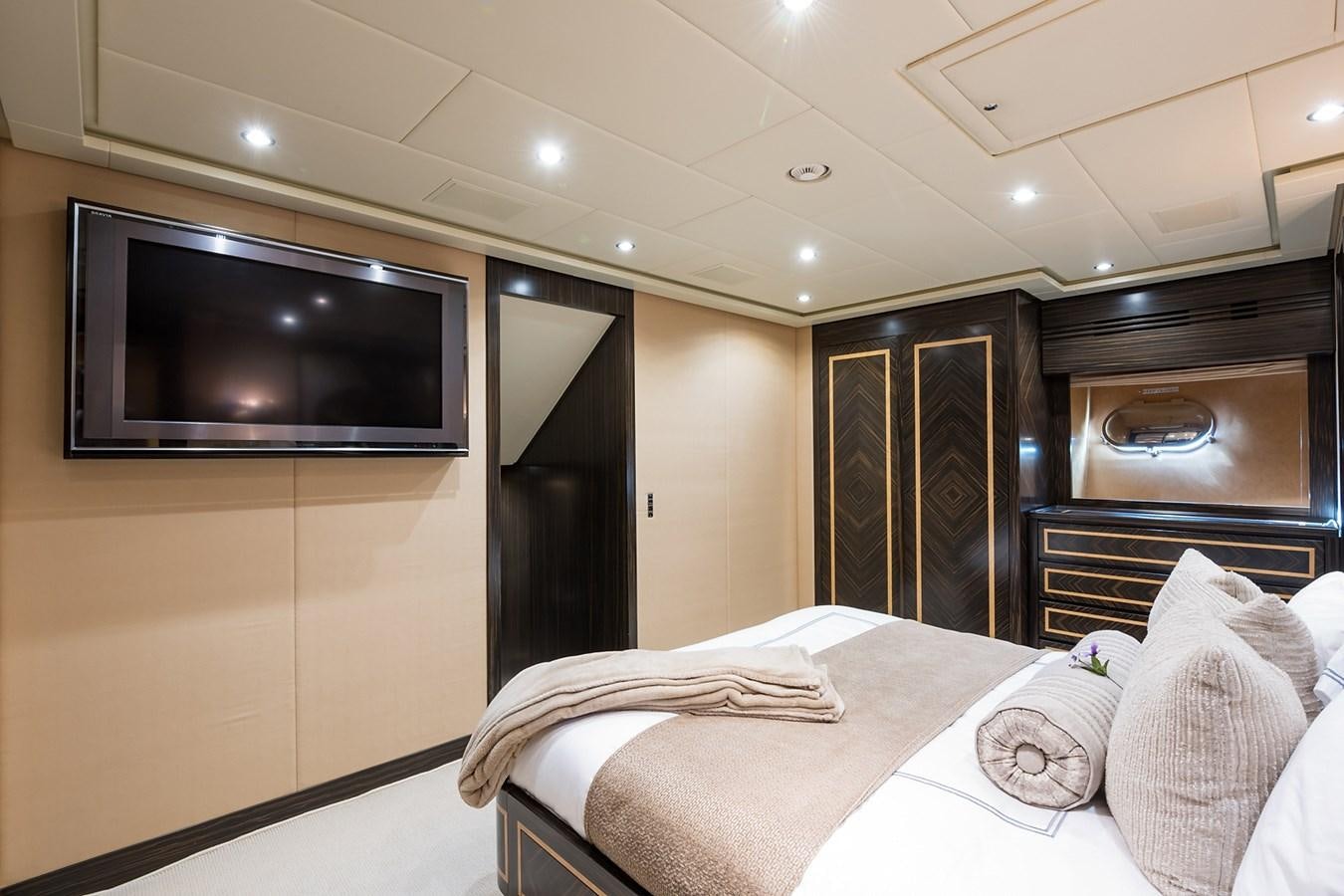 a bedroom with a tv and a bed aboard 34M LEOPARD Yacht for Sale