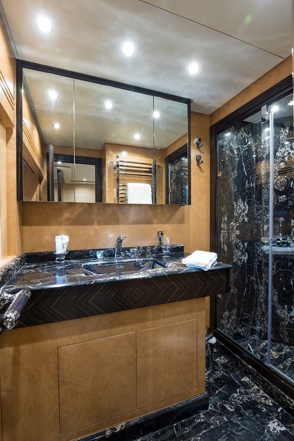 a bathroom with a countertop sink aboard 34M LEOPARD Yacht for Sale